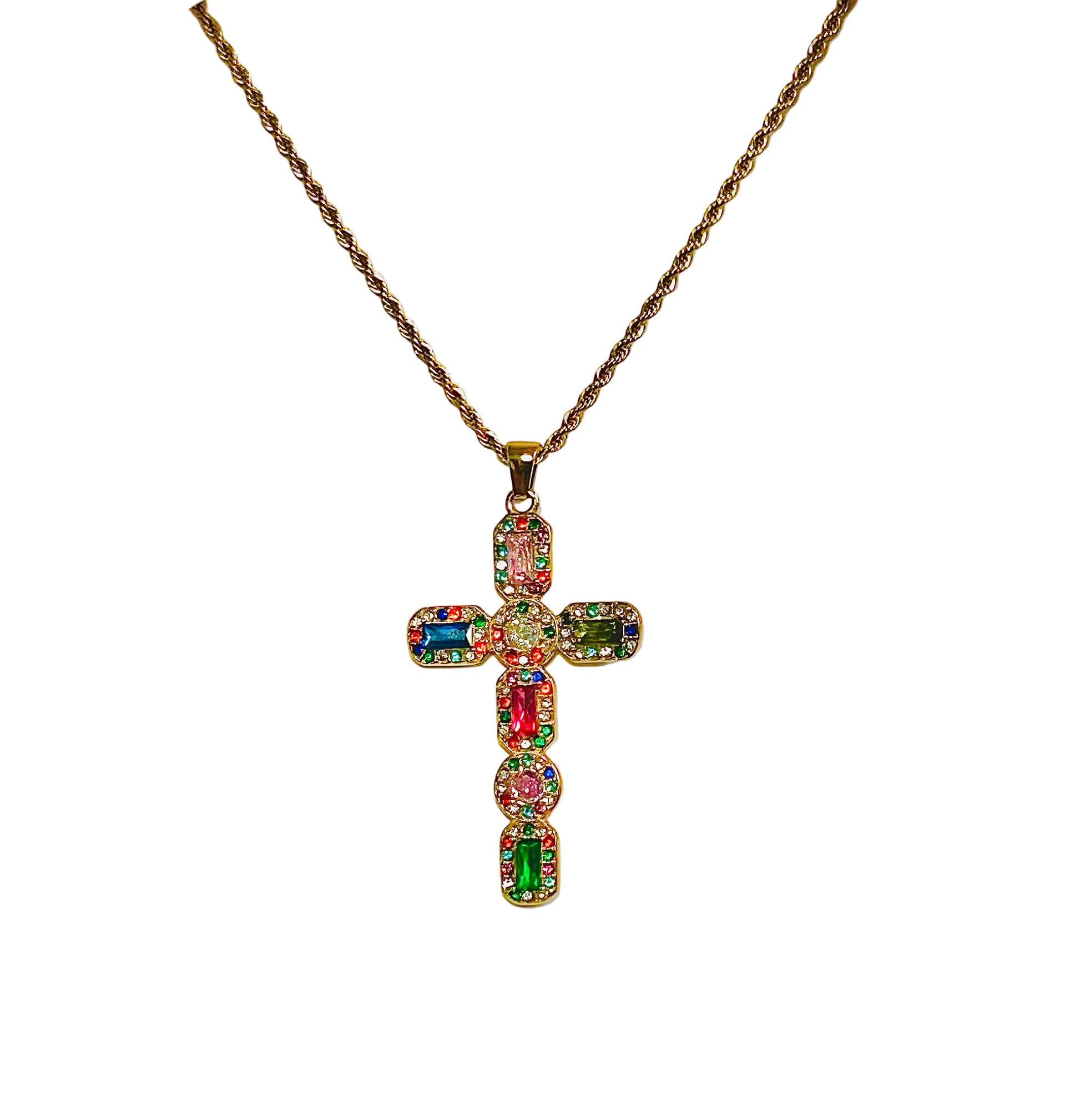 Multicolored gemstone cross pendant on a gold chain against a white background