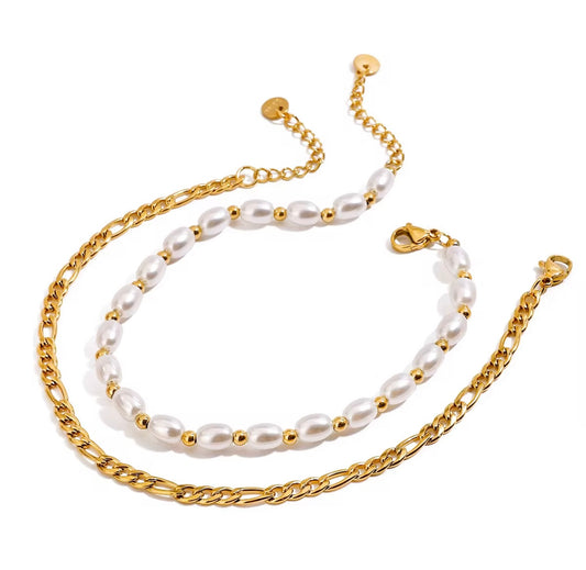 Two pearl and gold chain necklaces on a white background